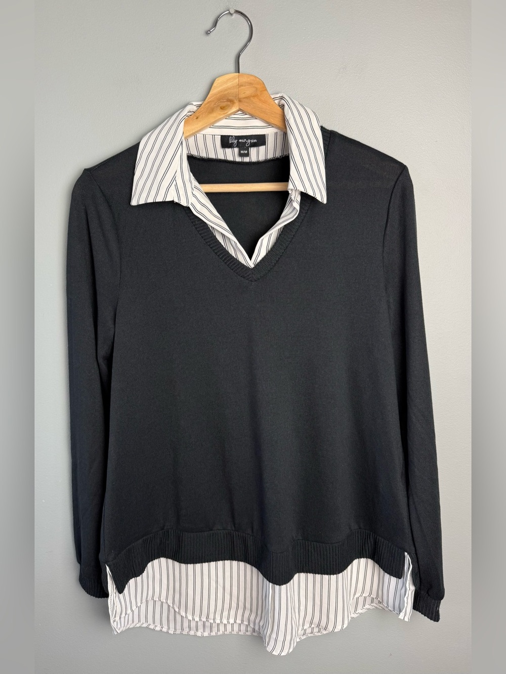 Black V‑Neck Layered Sweater with Striped Shirt Detail